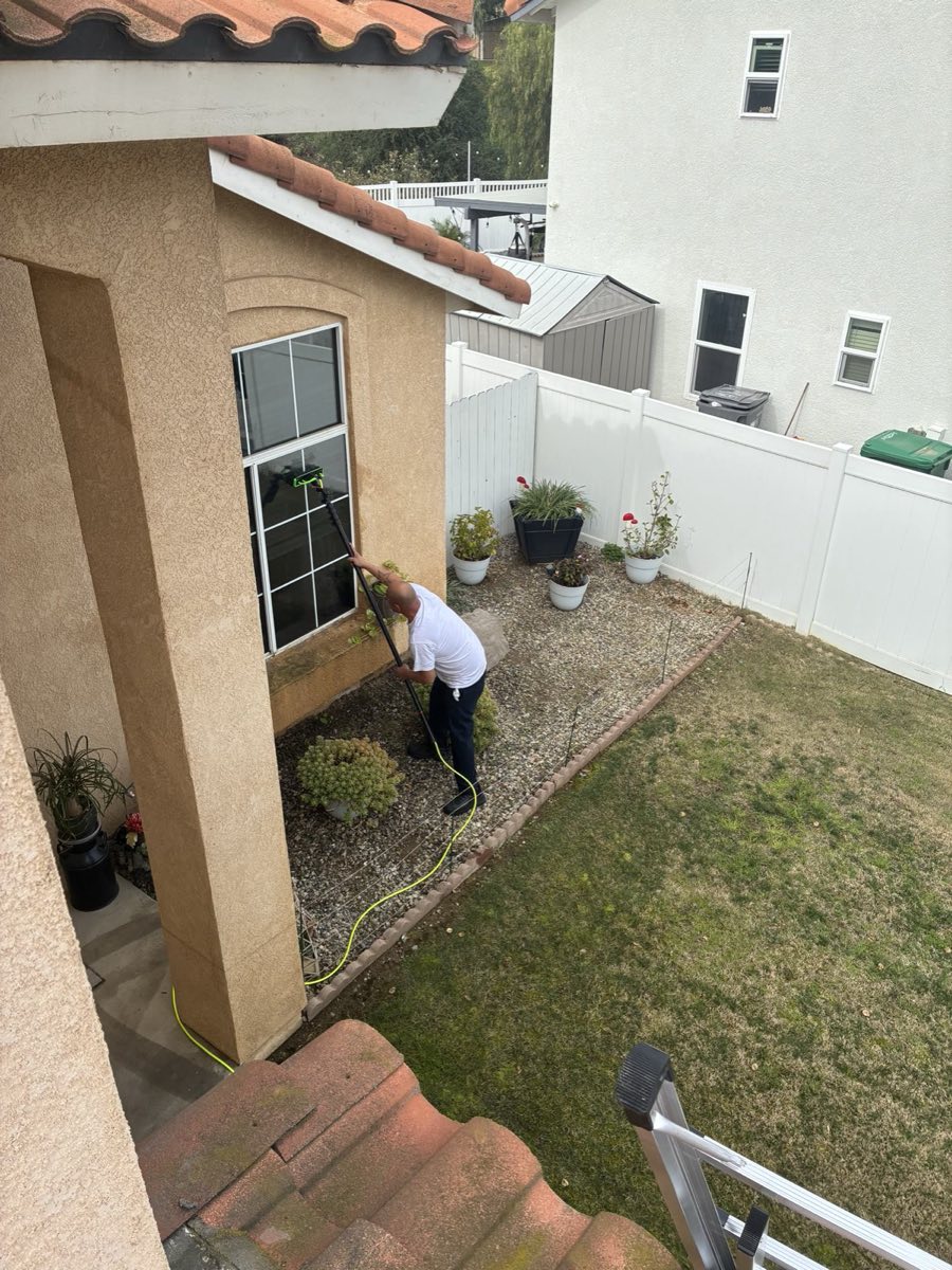 Northington Cleaning technician using a water-fed pole