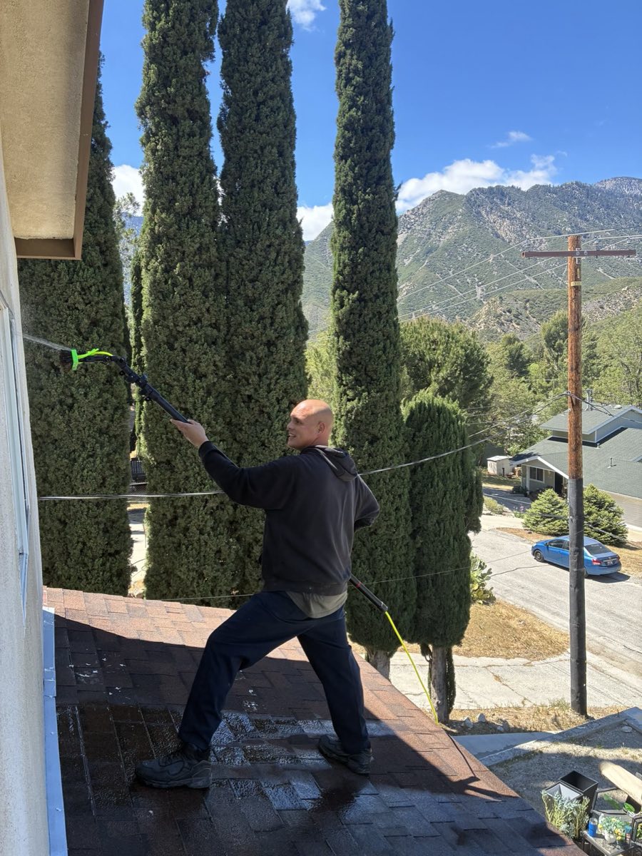 Northington Cleaning technician cleaning exterior windows