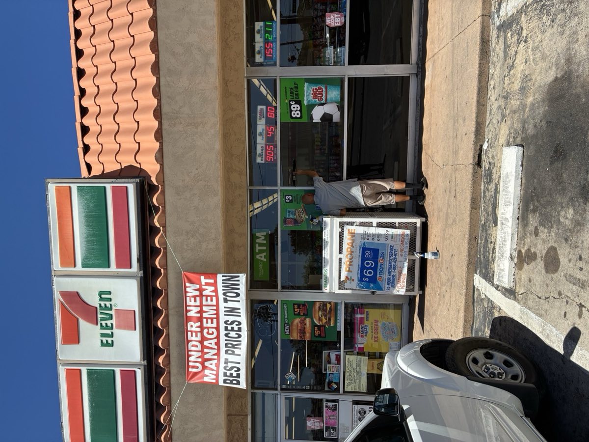 Commercial storefront window cleaning in progress